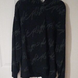 Jordan Black V-Neck Sweater with Subtle Script Pattern